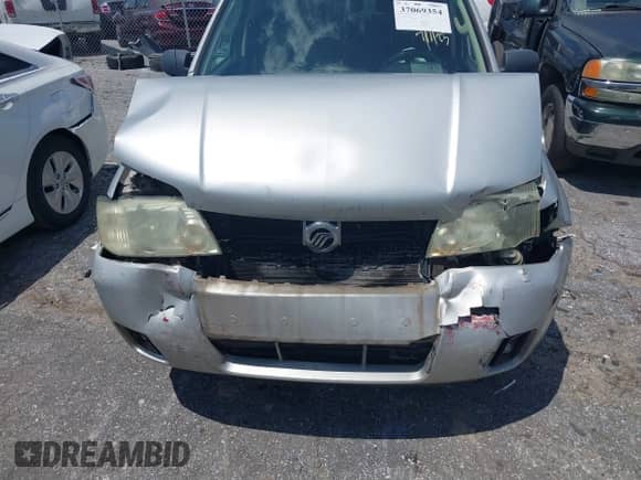 2005 Mercury Mariner Luxury z VIN 4M2YU561X5DJ09502, wystawiony jako IAAI lot #37069354 z przebiegiem Nie podano mil oraz . Historia ofert i sprzedaży dostępna na DreamBid. Obrazek 6.