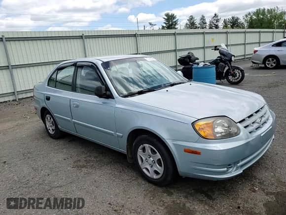 2004 Hyundai Accent GL z VIN KMHCG45C94U574027, wystawiony jako Copart lot #57463905 z przebiegiem 139 595 mil mil oraz Szkoda całkowita • Salvage title. Historia ofert i sprzedaży dostępna na DreamBid. Obrazek 14.