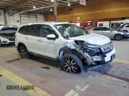 ✅ 2022 Honda Pilot Touring 7-Passenger • VIN: 5FNYF6H69NB029700 • Lot: 86212445. Listed on Copart with Not provided. Free auction sales archive from the USA and detailed vehicle history report at DreamBid. Image 4.