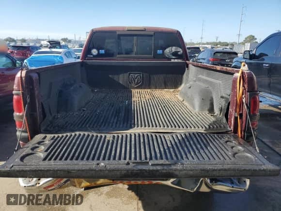 2001 Dodge 1500 z VIN 1B7HF13Z51J292550, wystawiony jako Copart lot #77139774 z przebiegiem 291 671 mil mil oraz Szkoda całkowita • Salvage title. Historia ofert i sprzedaży dostępna na DreamBid. Obrazek 6.