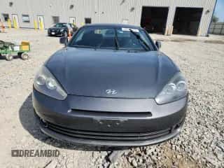 2007 Hyundai Tiburon GT с VIN KMHHN66F37U262161, выставлен на аукционе Copart как лот 80673555 с пробегом 127 895 миль миль и На запчасти • Non repairable. История ставок и продаж доступна на DreamBid. Изображение 5.