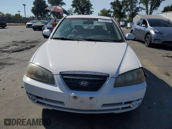 2004 Hyundai Elantra GLS with VIN KMHDN46D34U725333, listed as a Copart auction lot 71259335 with 242,751 mi miles and Salvage title. Bid and sale history available at DreamBid. Image 5.