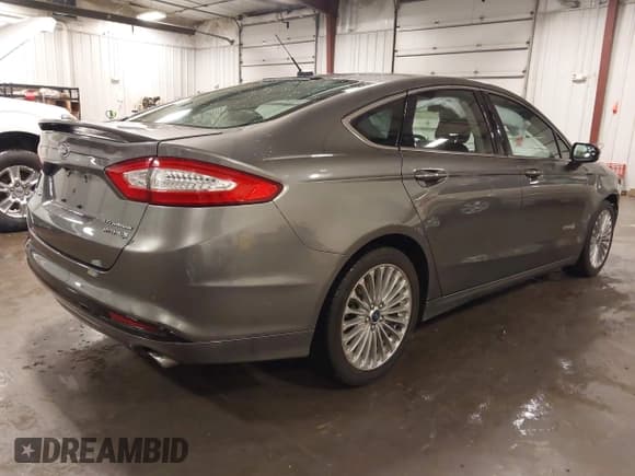 ✅ 2014 Ford Fusion Titanium Hybrid • VIN: 3FA6P0RU1ER217906 • Lot: 42563246. Listed on IAAI with 66,335 mi. Free auction sales archive from the USA and detailed vehicle history report at DreamBid. Image 4.