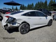 ✅ 2018 Honda Civic EX-L • VIN: JHMFC1F88JX041083 • Лот: 68244135. Опубликован ранее на Copart с пробегом 98 648 миль. Бесплатный доступ к архиву аукционных продаж из США и подробный отчёт об истории автомобиля на DreamBid. Изображение 3.