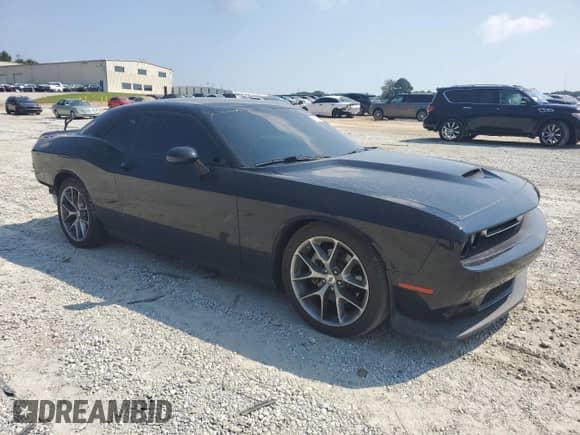2022 Dodge Challenger GT with VIN 2C3CDZJG4NH237471, listed as a Copart auction lot 71077195 with 63,876 mi miles and Salvage title. Bid and sale history available at DreamBid. Image 4.