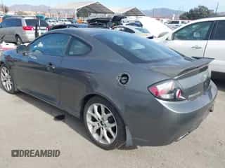 2007 Hyundai Tiburon GT z VIN KMHHN66F37U251290, wystawiony jako IAAI lot #41355889 z przebiegiem 135 374 mil mil oraz . Historia ofert i sprzedaży dostępna na DreamBid. Obrazek 3.