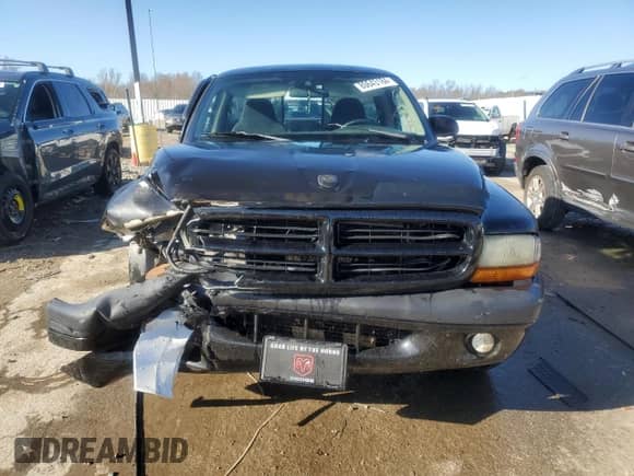 2002 Dodge Dakota Sport z VIN 1B7FL36XX2S643163, wystawiony jako Copart lot #80643184 z przebiegiem 230 990 mil mil oraz Nie do naprawy • Non repairable. Historia ofert i sprzedaży dostępna na DreamBid. Obrazek 5.