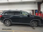 ✅ 2016 Honda Pilot Touring • VIN: 5FNYF5H91GB006631 • Lot: 43566110. Listed on IAAI with 144,494 mi. Free auction sales archive from the USA and detailed vehicle history report at DreamBid. Image 12.
