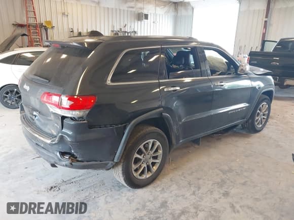✅ 2015 Jeep Grand Cherokee Limited • VIN: 1C4RJFBG0FC854611 • Lot: 42915098. Listed on IAAI with 144,057 mi. Free auction sales archive from the USA and detailed vehicle history report at DreamBid. Image 4.