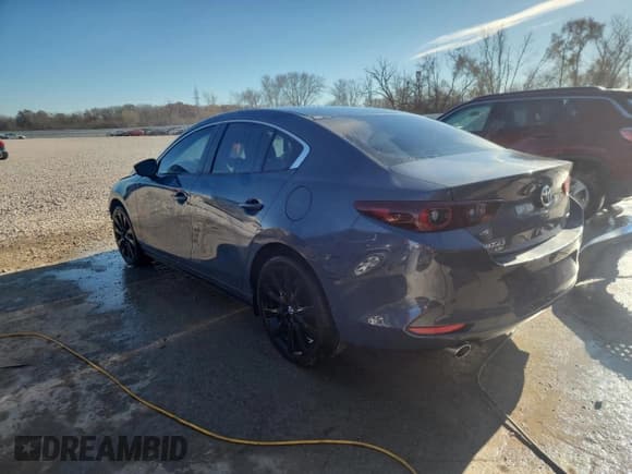 ✅ 2024 Mazda 3 S Carbon Edition • VIN: 3MZBPBCM4RM412654 • Lot: 92630065. Listed on Copart with 10,776 mi. Free auction sales archive from the USA and detailed vehicle history report at DreamBid. Image 2.
