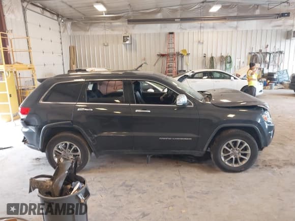 ✅ 2015 Jeep Grand Cherokee Limited • VIN: 1C4RJFBG0FC854611 • Lot: 42915098. Listed on IAAI with 144,057 mi. Free auction sales archive from the USA and detailed vehicle history report at DreamBid. Image 13.