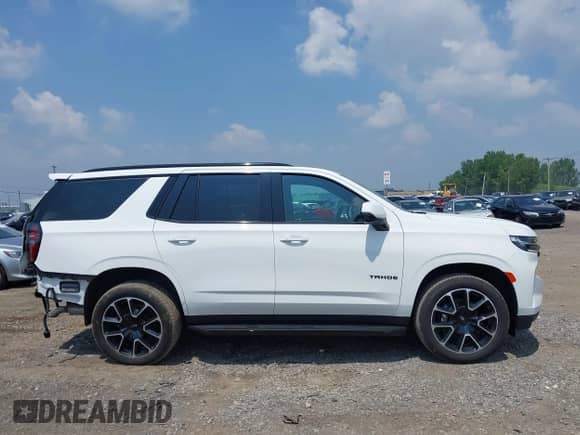 2023 Chevrolet Tahoe RST z VIN 1GNSKRKD4PR334794, wystawiony jako IAAI lot #42717947 z przebiegiem 55 265 mil mil oraz . Historia ofert i sprzedaży dostępna na DreamBid. Obrazek 13.