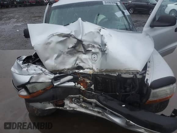 2003 Dodge Dakota Sport z VIN 1D7HG38N83S265442, wystawiony jako Copart lot #84969985 z przebiegiem Nie podano mil oraz Szkoda całkowita • Salvage title. Historia ofert i sprzedaży dostępna na DreamBid. Obrazek 11.