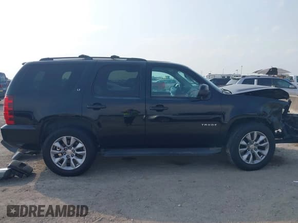 ✅ 2014 Chevrolet Tahoe LT • VIN: 1GNSCBE07ER240788 • Lot: 43016942. Listed on IAAI with 181,963 mi. Free auction sales archive from the USA and detailed vehicle history report at DreamBid. Image 13.