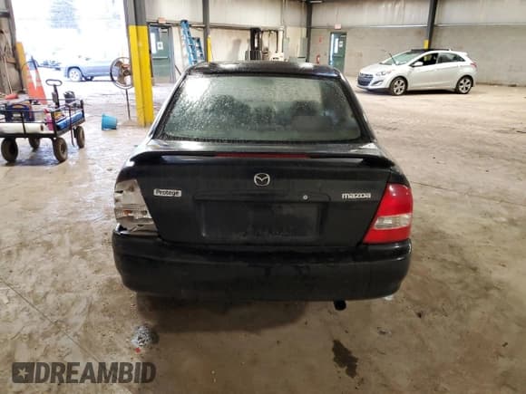 ✅ 2001 Mazda Protege LX • VIN: JM1BJ225710490366 • Лот: 44670235. Опубликован ранее на Copart с пробегом 217 746 миль. Бесплатный доступ к архиву аукционных продаж из США и подробный отчёт об истории автомобиля на DreamBid. Изображение 6.