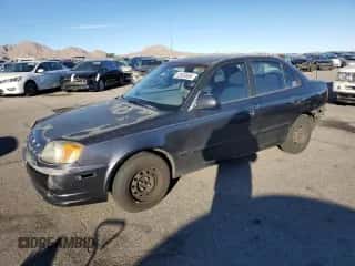 2005 Hyundai Accent GLS with VIN KMHCG45C95U665574, listed as a Copart auction lot 82603804 with 154,187 mi miles and Salvage title. Bid and sale history available at DreamBid. Image 1.