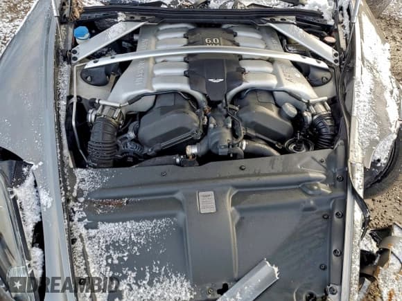 ✅ 2005 Aston Martin DB9 • VIN: SCFAD01A55GA00949 • Lot: 93496245. Wystawiony na Copart z przebiegiem 68 717 mil. Bezpłatny archiwum sprzedaży aukcyjnych z USA i szczegółowy raport historii pojazdu na DreamBid. Zdjęcie 11.