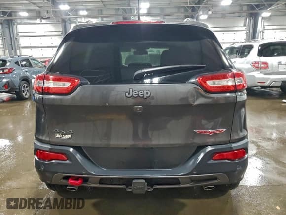 ✅ 2015 Jeep Cherokee Trailhawk • VIN: 1C4PJMBSXFW570174 • Lot: 94323375. Listed on Copart with 138,885 mi. Free auction sales archive from the USA and detailed vehicle history report at DreamBid. Image 6.
