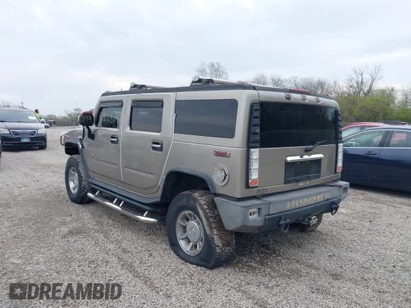 ✅ 2004 Hummer H2 • VIN: 5GRGN23U94H100078 • Lot: 42028741. Listed on IAAI with 106,795 mi. Free auction sales archive from the USA and detailed vehicle history report at DreamBid. Image 3.