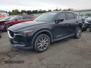 ✅ 2020 Mazda CX-5 Grand Touring • VIN: JM3KFADM4L0727082 • Lot: 81841715. Listed on Copart with 95,487 mi. Free auction sales archive from the USA and detailed vehicle history report at DreamBid. Image 1.