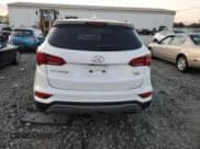 ✅ 2017 Hyundai Santa Fe 2.4L • VIN: 5NMZUDLB9HH016404 • Lot: 86643515. Listed on Copart with 73,795 mi. Free auction sales archive from the USA and detailed vehicle history report at DreamBid. Image 6.