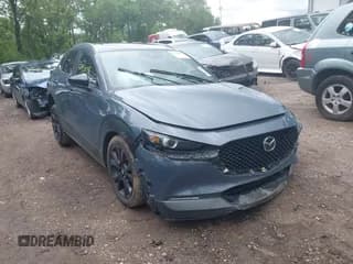 ✅ 2023 Mazda CX-30 S Carbon Edition • VIN: 3MVDMBCM8PM570852 • Lot: 42438356. Listed on IAAI with 31,257 mi. Free auction sales archive from the USA and detailed vehicle history report at DreamBid. Image 1.