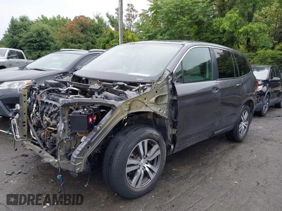 ✅ 2017 Honda Pilot EX-L • VIN: 5FNYF5H77HB033090 • Lot: 42359412. Listed on IAAI with 131,032 mi. Free auction sales archive from the USA and detailed vehicle history report at DreamBid. Image 2.