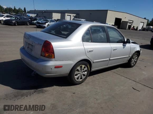 2005 Hyundai Accent GLS with VIN KMHCG45C55U623340, listed as a Copart auction lot 59587304 with 275,364 mi miles and Salvage title. Bid and sale history available at DreamBid. Image 3.