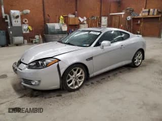 ✅ 2007 Hyundai Tiburon GT • VIN: KMHHN66F47U251850 • Лот: 51900565. Опубликован ранее на Copart с пробегом 130 388 миль. Бесплатный доступ к архиву аукционных продаж из США и подробный отчёт об истории автомобиля на DreamBid. Изображение 1.