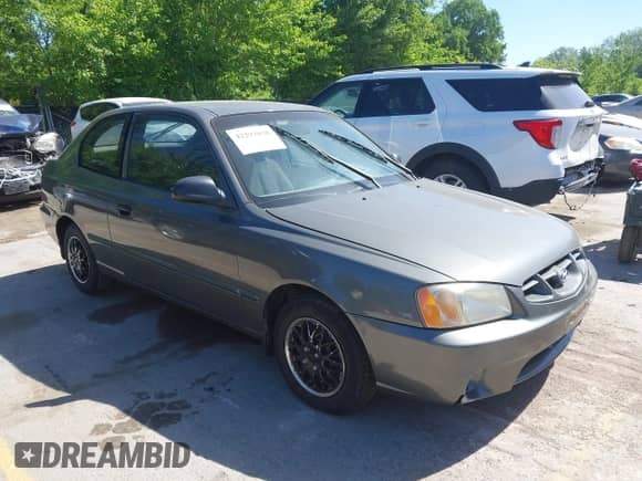 2001 Hyundai Accent GS z VIN KMHCG35C01U136132, wystawiony jako IAAI lot #42293830 z przebiegiem 111 906 mil mil oraz . Historia ofert i sprzedaży dostępna na DreamBid. Obrazek 1.