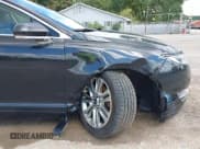 ✅ 2015 Lincoln MKZ • VIN: 3LN6L2G94FR625555 • Lot: 43052508. Listed on IAAI with 103,338 mi. Free auction sales archive from the USA and detailed vehicle history report at DreamBid. Image 17.