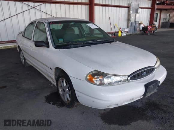 ✅ 1999 Ford Contour LX • VIN: 1FAFP66L7XK208536 • Лот: 43812424. Опубликован ранее на IAAI с пробегом 164 345 миль. Бесплатный доступ к архиву аукционных продаж из США и подробный отчёт об истории автомобиля на DreamBid. Изображение 1.