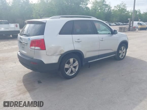 ✅ 2012 Kia Sorento EX • VIN: 5XYKUDA21CG235090 • Lot: 42386362. Listed on IAAI with 163,595 mi. Free auction sales archive from the USA and detailed vehicle history report at DreamBid. Image 4.