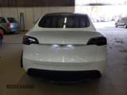 ✅ 2024 Tesla Model Y Long Range • VIN: 7SAYGAEE4RF121950 • Лот: 87409655. Опубликован ранее на Copart с пробегом 23 700 миль. Бесплатный доступ к архиву аукционных продаж из США и подробный отчёт об истории автомобиля на DreamBid. Изображение 6.