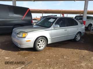 2003 Hyundai Accent GL z VIN KMHCG45C93U476176, wystawiony jako IAAI lot #41940608 z przebiegiem 212 264 mil mil oraz . Historia ofert i sprzedaży dostępna na DreamBid. Obrazek 2.