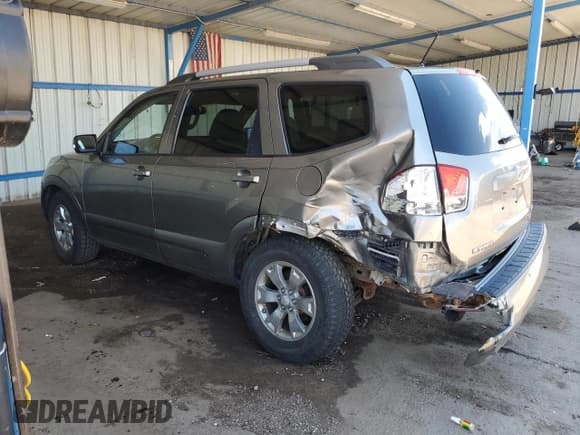 ✅ 2009 Kia Borrego EX • VIN: KNDJH741295029900 • Lot: 66734114. Listed on Copart with 134,652 mi. Free auction sales archive from the USA and detailed vehicle history report at DreamBid. Image 2.