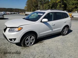 ✅ 2012 Hyundai Santa Fe SE • VIN: 5XYZH4AG4CG110518 • Lot: 77423244. Listed on Copart with 170,903 mi. Free auction sales archive from the USA and detailed vehicle history report at DreamBid. Image 1.