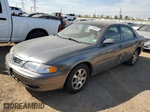 ✅ 2001 Mazda 626 LX • VIN: 1YVGF22C715200453 • Lot: 84706015. Wystawiony na Copart z przebiegiem 63 514 mil. Bezpłatny archiwum sprzedaży aukcyjnych z USA i szczegółowy raport historii pojazdu na DreamBid. Zdjęcie 1.