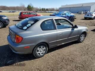 2005 Hyundai Accent GLS z VIN KMHCG35C65U331867, wystawiony jako Copart lot #49637495 z przebiegiem 63 901 mil mil oraz Czysty tytuł • Clean title. Historia ofert i sprzedaży dostępna na DreamBid. Obrazek 3.