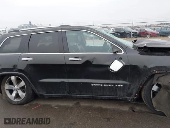 ✅ 2015 Jeep Grand Cherokee Overland • VIN: 1C4RJFCG3FC665854 • Lot: 41697999. Listed on IAAI with 206,618 mi. Free auction sales archive from the USA and detailed vehicle history report at DreamBid. Image 13.