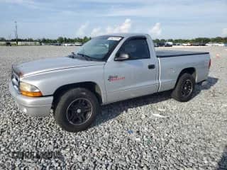2001 Dodge Dakota z VIN 1B7FL26X31S345868, wystawiony jako Copart lot #61427515 z przebiegiem 87 073 mil mil oraz Szkoda całkowita • Salvage title. Historia ofert i sprzedaży dostępna na DreamBid. Obrazek 1.