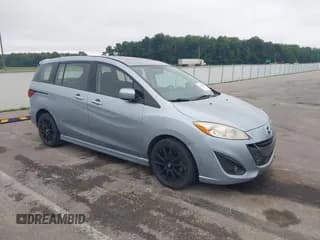 ✅ 2012 Mazda 5 Touring • VIN: JM1CW2CL7C0115096 • Lot: 42524956. Listed on IAAI with 173,155 mi. Free auction sales archive from the USA and detailed vehicle history report at DreamBid. Image 1.