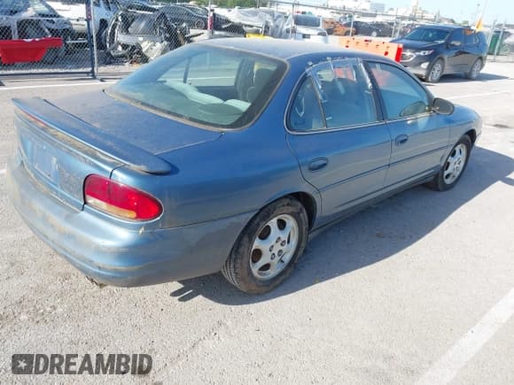 ✅ 1998 Oldsmobile Intrigue GX • VIN: 1G3WH52KXWF393882 • Lot: 42056782. Listed on IAAI with 223,763 mi. Free auction sales archive from the USA and detailed vehicle history report at DreamBid. Image 4.