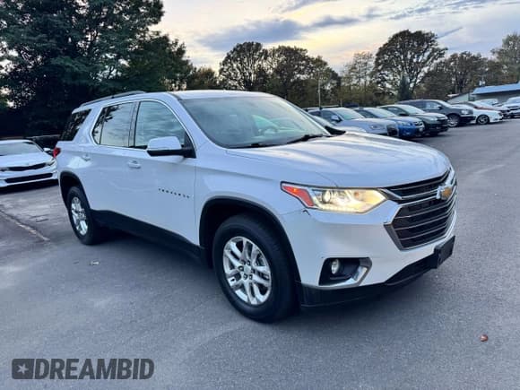 ✅ 2021 Chevrolet Traverse LT Cloth • VIN: 1GNERGKWXMJ233252 • Лот: 90199225. Опубликован ранее на Copart с пробегом 124 379 миль. Бесплатный доступ к архиву аукционных продаж из США и подробный отчёт об истории автомобиля на DreamBid. Изображение 1.