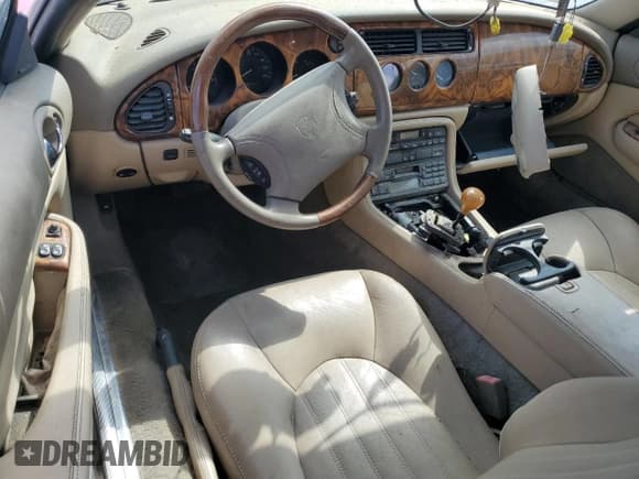 ✅ 1999 Jaguar XK • VIN: SAJGX2044XC038236 • Lot: 81923635. Listed on Copart with 44,616 mi. Free auction sales archive from the USA and detailed vehicle history report at DreamBid. Image 8.