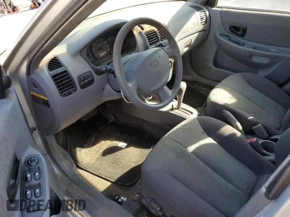 2005 Hyundai Accent GLS with VIN KMHCG45C75U638812, listed as a Copart auction lot 77968234 with 130,815 mi miles and Salvage title. Bid and sale history available at DreamBid. Image 8.