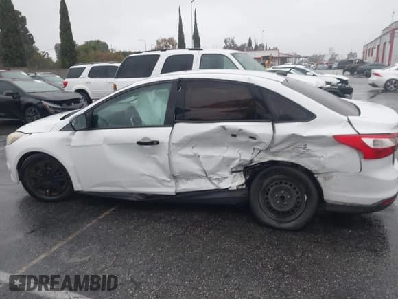 ✅ 2014 Ford Focus S • VIN: 1FADP3E20EL198440 • Lot: 43704241. Listed on IAAI with 78,827 mi. Free auction sales archive from the USA and detailed vehicle history report at DreamBid. Image 6.