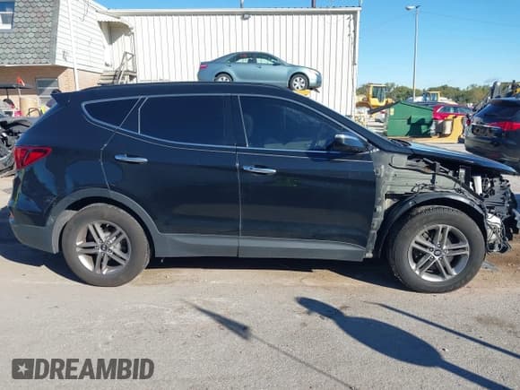 ✅ 2017 Hyundai Santa Fe 2.4L • VIN: 5XYZUDLB4HG448733 • Lot: 43522113. Listed on IAAI with 156,802 mi. Free auction sales archive from the USA and detailed vehicle history report at DreamBid. Image 14.