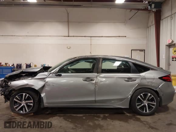 ✅ 2023 Honda Civic LX • VIN: 19XFL2H56PE013429 • Lot: 43223544. Listed on IAAI with 23,000 mi. Free auction sales archive from the USA and detailed vehicle history report at DreamBid. Image 17.