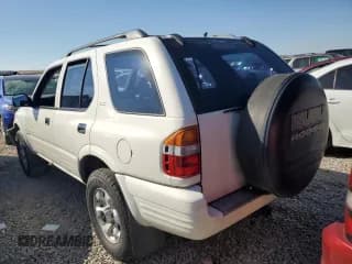 ✅ 1999 Isuzu Rodeo S • VIN: 4S2CM58W0X4306727 • Lot: 74758994. Wystawiony na Copart z przebiegiem 193 850 mil. Bezpłatny archiwum sprzedaży aukcyjnych z USA i szczegółowy raport historii pojazdu na DreamBid. Zdjęcie 2.